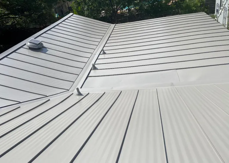 Solar attic fan installed on a metal roof for Roof Ventilation in New Scotland